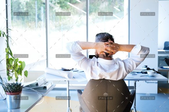 demo attachment 31 businessman at the desk in his office resting.